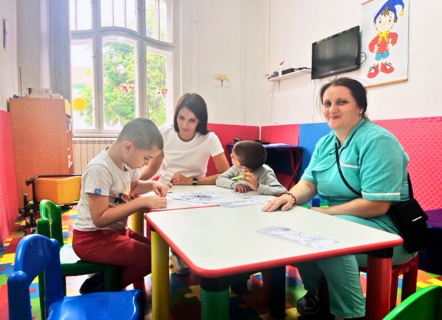 Preschool children drawing together at a table
